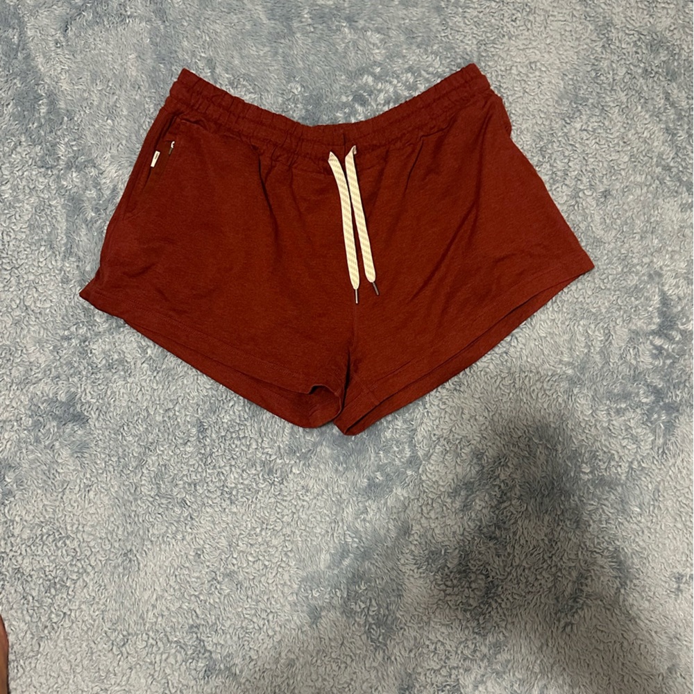 Vuori Women's Athletic Shorts in Rust Red